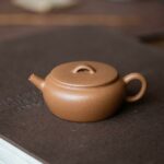 Duanni 110ml Bian Yuan Flat Round Yixing Teapot